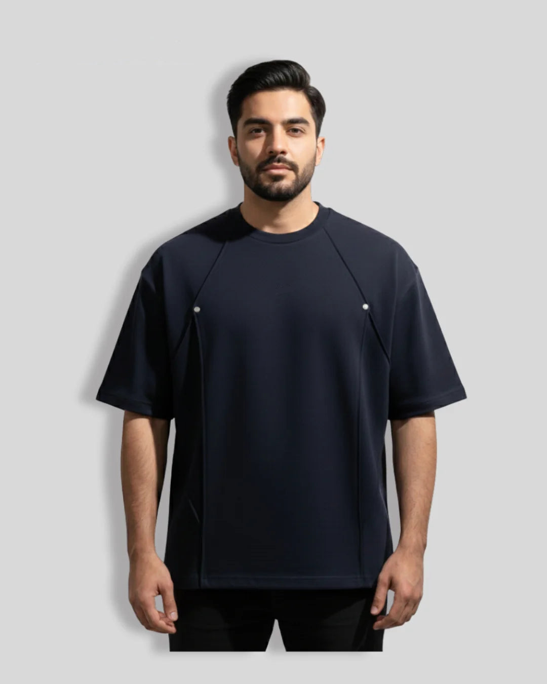 Man wearing a black Balera t-shirt on a light gray background