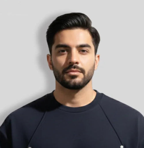 Man wearing a black Balera t-shirt on a light gray background